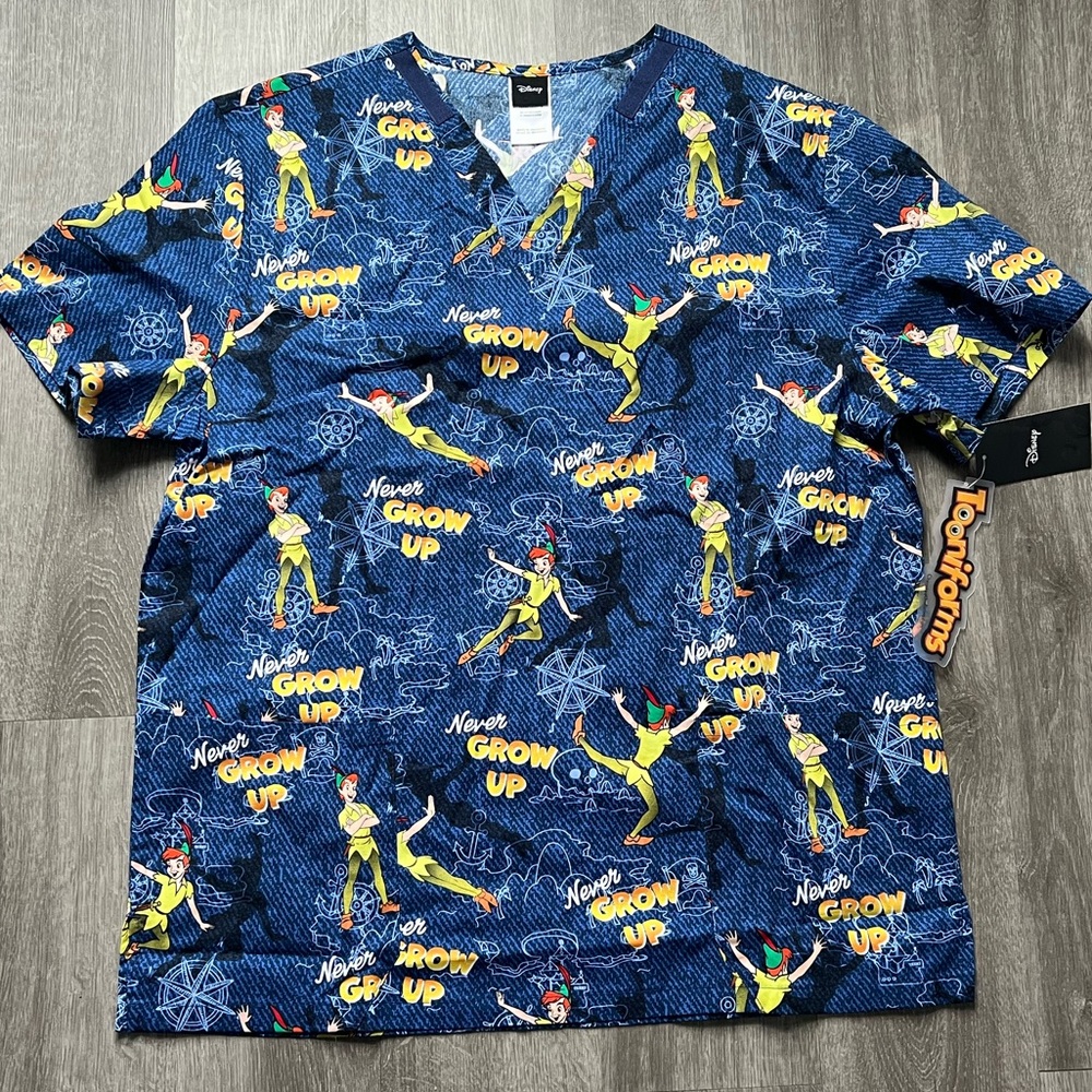 NWT Women’s Large Disney Tooniforms  Peter Pan Never Grow Up Scrub Top